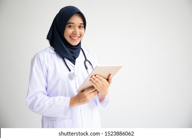 Young Arab Muslim Hijab Doctor Women Smile On Isolate White Background Concept For Islam Asian Working In Heart Medical Hospital Health Care, Modern Nurse Wearing Hijab In Medico Clinic Business 