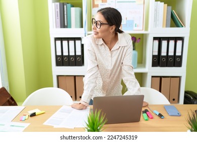 Young arab woman business worker smiling confident standing by desk at office - Shutterstock ID 2247245319