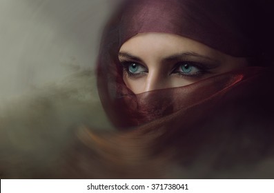 Young arabian woman in hijab with sexy blue eyes. Yashmak. 