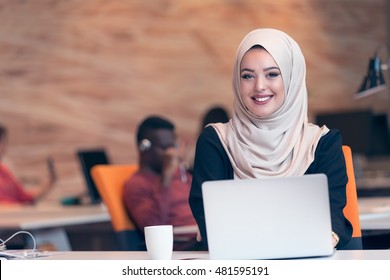 Young Arabic Business Woman Wearing Hijab,working In Her Startup Office. Diversity, Multiracial Concept