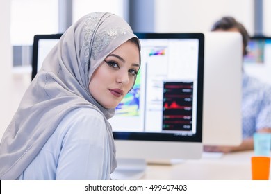 Young Arabic Business Woman Wearing Hijab,working In Her Startup Office.