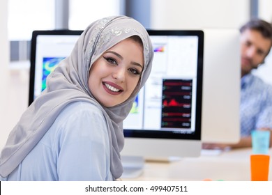 Young Arabic Business Woman Wearing Hijab,working In Her Startup Office.