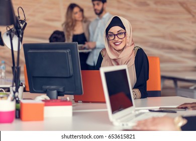 Young Arabic Business Woman Wearing Hijab,working In Her Startup Office.