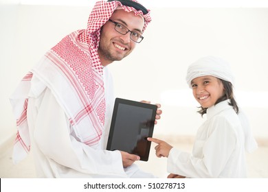 Young Arabic Father And Kids At Home