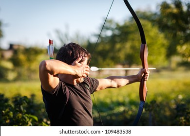 Young archer training with the  bow