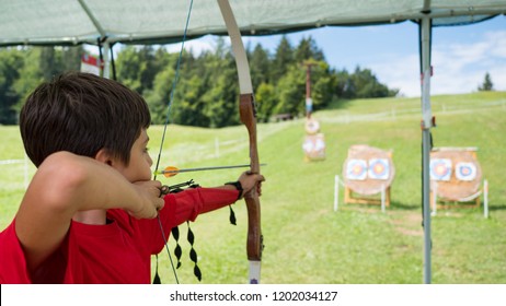 Young Archery Kid Outdoors.