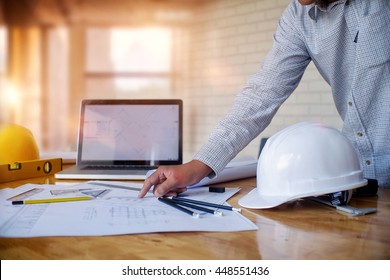 Young Architect Man Or Engineer Working On His Plane Project At Site Construction Work.