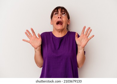 Young Argentinian woman isolated on white background screaming to the sky, looking up, frustrated.