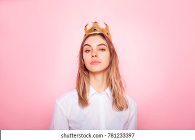 Young Arrogant Woman In Crown On Pink Background