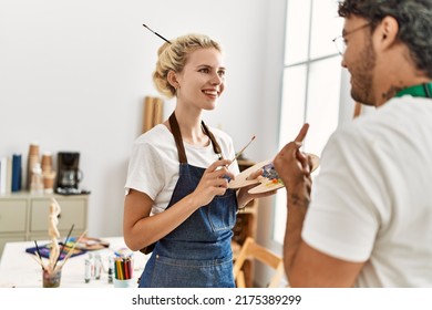 Young Artist Couple Smiling Happy Speaking At Art Studio.