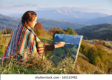 Young artist painting an autumn landscape - Powered by Shutterstock