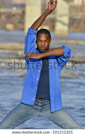 Young artistic dancer stretching and practicing at Belle Isle in Richmond, Virginia.