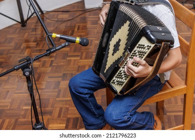 Young Artists Playing Their Instruments At A Music Recital