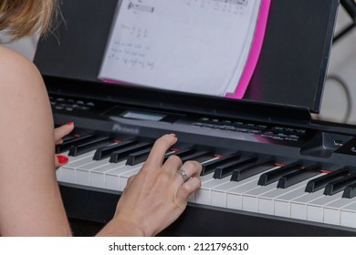 Young Artists Playing Their Instruments At A Music Recital