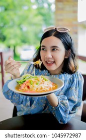 Young Asain Girl Enjoy Eatting Papa Salad (som Tom) Popular Thai Food