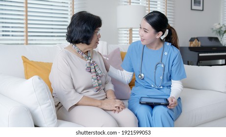 Young Asia Female Nurse, Assisted Living, In-home Carer Or Doctor Visit Old Senior Citizen At Home Talk About Result Follow Up Checklist, Health Care Advice Or Prescription Online On Tablet Computer.