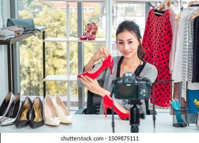 Young Asia Friendly Girl Live Video Blog (vlogger) And Sales Shoes In Online E-commerce Shopping At Shop.