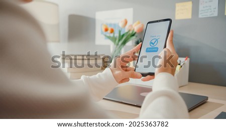 Young asia lady use cellphone order online shopping product and paying bills with banking app with transaction successful. Stay at house, Quarantine activity, Fun activity for coronavirus prevention. Сток-фото © 