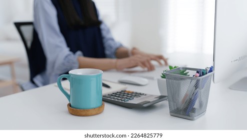 Young asia people female worker sit at table desk busy work day begin with hot caffeine herbal power boost cup. MBA lady student teen girl relax remote distant learn enjoy good time at home office.