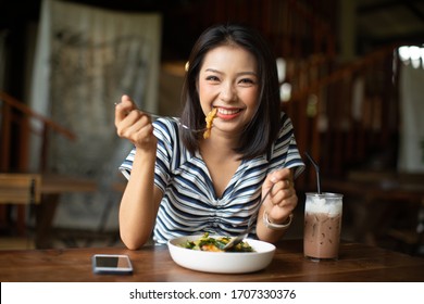 Young Asia Woman Eating Spaghetti At Restaurant