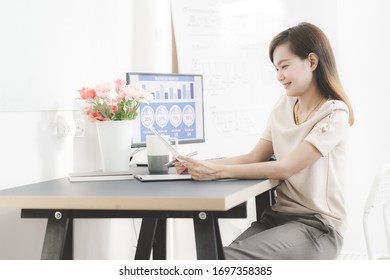 Young asia woman working at home or in a small office. Asian people - Shutterstock ID 1697358385