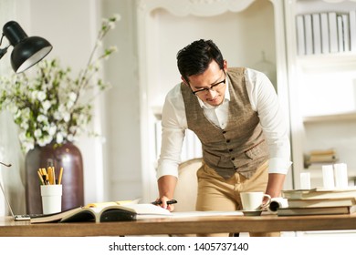 Young Asian Architect Designer Standing In Fromt Of Desk Working At Home