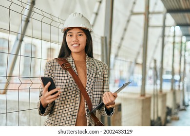 Young Asian Architect Woman Smiling Happy Using Smartphone At The City.