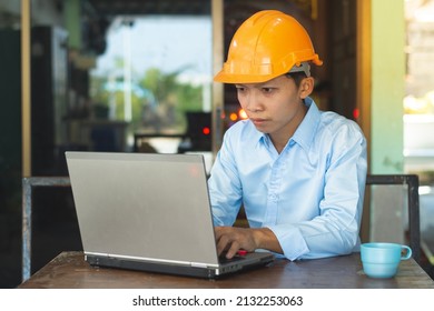 Young Asian Architect Is Working On A Laptop Computer.