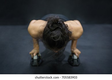 Young Asian Athlete Woman Doing Push Up With Push-up Bars On The Floor, Sport And Training In Fitness Gym Concepts