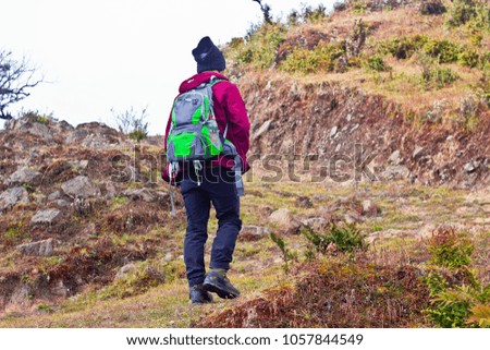 Young Asian backpacker hiking in Himalaya