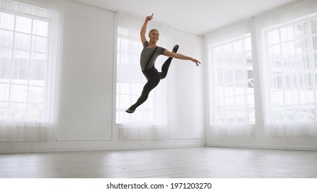 Young Asian Ballet Dancer Practicing In A Room Alone.