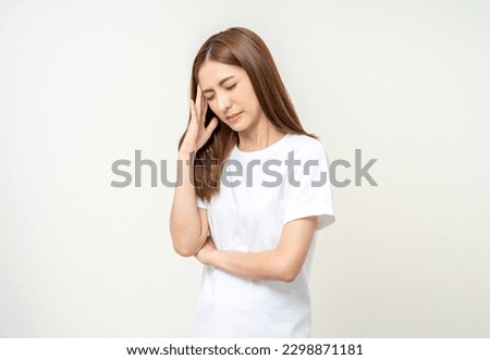 Young asian beautiful woman hand touching head she's feeling depressed stress headache be tired from working standing on isolated white background she has symptom office syndrome.