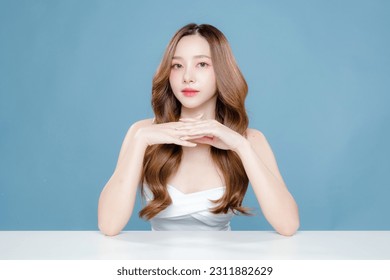 Young Asian beauty woman curly long hair with korean makeup style on face and perfect clean skin on isolated blue background. Facial treatment, Cosmetology, plastic surgery. - Powered by Shutterstock