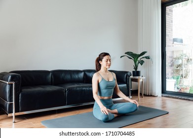 Young Asian Beauty Woman Doing Yoga At Home