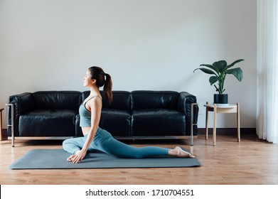 Young Asian Beauty Woman Doing Yoga At Home