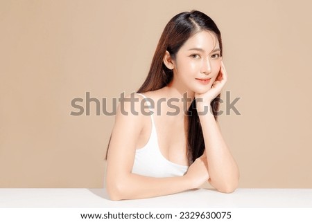 Young Asian beauty woman model long hair with korean makeup style on face and perfect skin on isolated beige background. Facial treatment, Cosmetology, Spa, Aesthetic, plastic surgery.