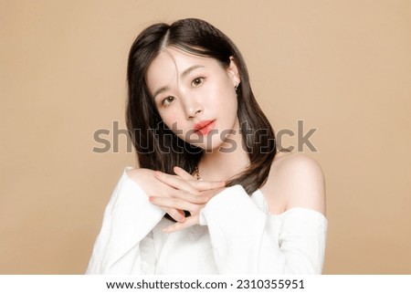 Young Asian beauty woman short hair with korean makeup style on face and perfect clear fresh skin on isolated beige background. Facial treatment, Cosmetology, plastic surgery.