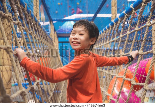 Young Asian Boy Climbing Net Indoor Stock Photo Edit Now