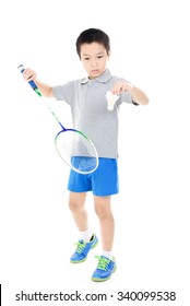 Young asian boy play badminton on white background