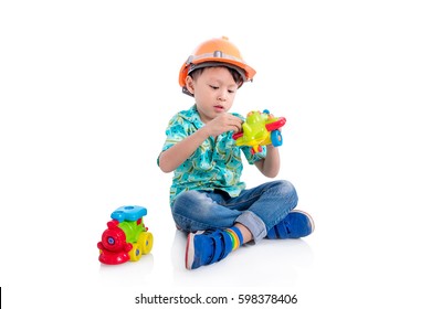 Young Asian Boy Playing Toy On The Floor