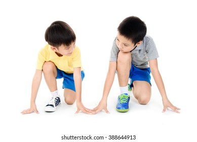 Young Asian Boy Prepare To Start Running Race On White Background