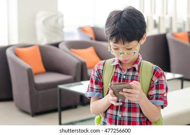 Young Asian Boy Searching Map On Smart Phone