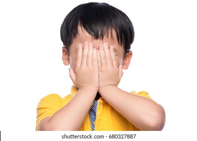 Young Asian Boy Shy Or Scared, Hide His Eyes By Hands.