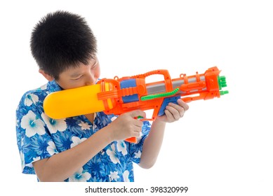 Young Asian Boy With Water Gun