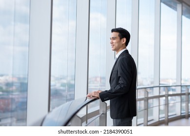 Young Asian Business Man Stand Looking Away , Smart Business Concept.