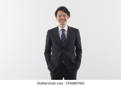 A Young Asian Business Man Standing With Smile.