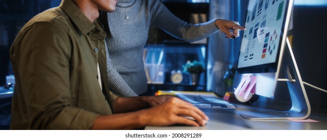 Young Asian Business Man And Woman Work Late Night Together On Desktop Computer With Team In Home Office. Project Brainstorm Meeting, Small Business Startup, Coworker Cooperate Teamwork Concept