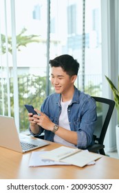 Young Asian Business Men Working With Laptop Phone In Coffee Shop Cafe.