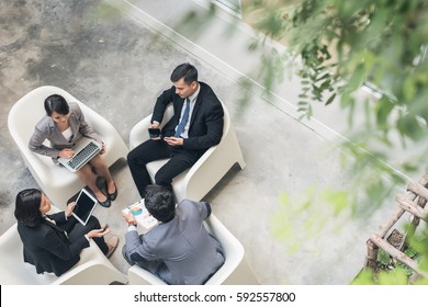 young asian business team discuss at the outdoor - Shutterstock ID 592557800