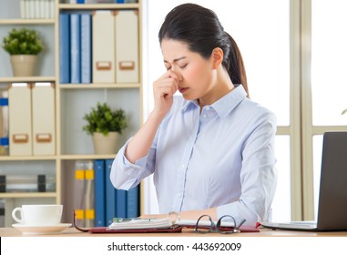 Young Asian Business Woman With Cold In Office